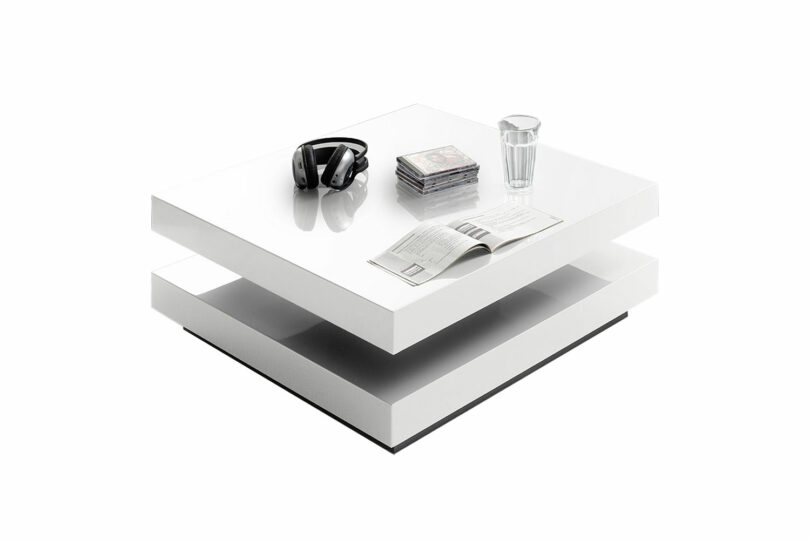 Table de salon laquée blanc brillant plateau pivotant