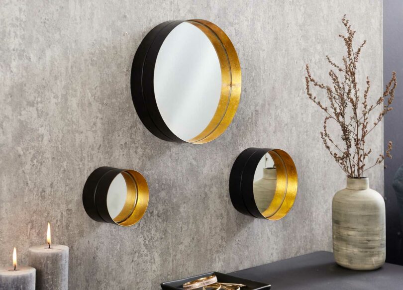 Miroirs muraux ronds en métal noir et or