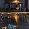 table repas design en verre noir et pieds dore