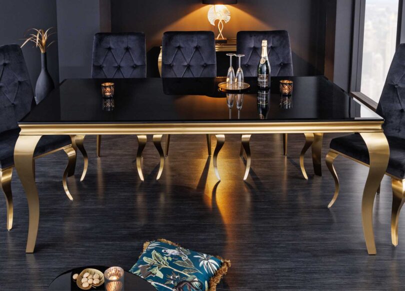 table repas design en verre noir et pieds dore