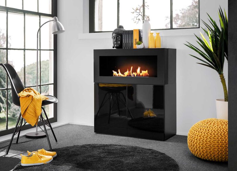meuble commode de rangement noir design avec cheminee decorative