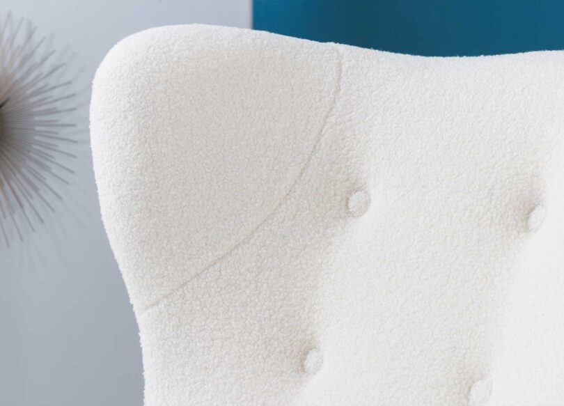 Oreille du fauteuil en tissu bouclé
