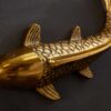 Zoom sur le poisson mural doré