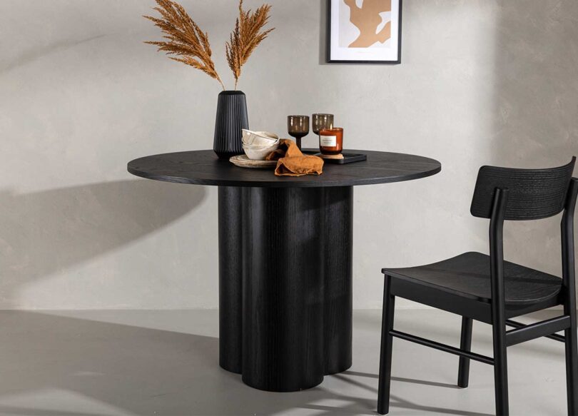 table salle à manger minimaliste aspect bois noir 110 cm pieds cylindre