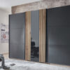 Armoire de 300cm aspect chêne et gris graphite 3 portes coulissantes dont une en verre fumé gris