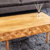 Table basse en bois d'acacia massif miel 100cm avec façades sculptées naturel