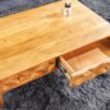 Table basse en bois d'acacia massif miel 100cm avec façades sculptées naturel