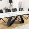 Table de repas extensible blanche marbrée avec piétement en métal noir ellipse