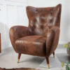 Fauteuil oreille marron antique