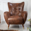 Fauteuil oreille marron antique