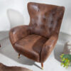 Fauteuil oreille marron antique