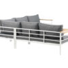 Canapé d'angle de jardin avec table basse vu de dos