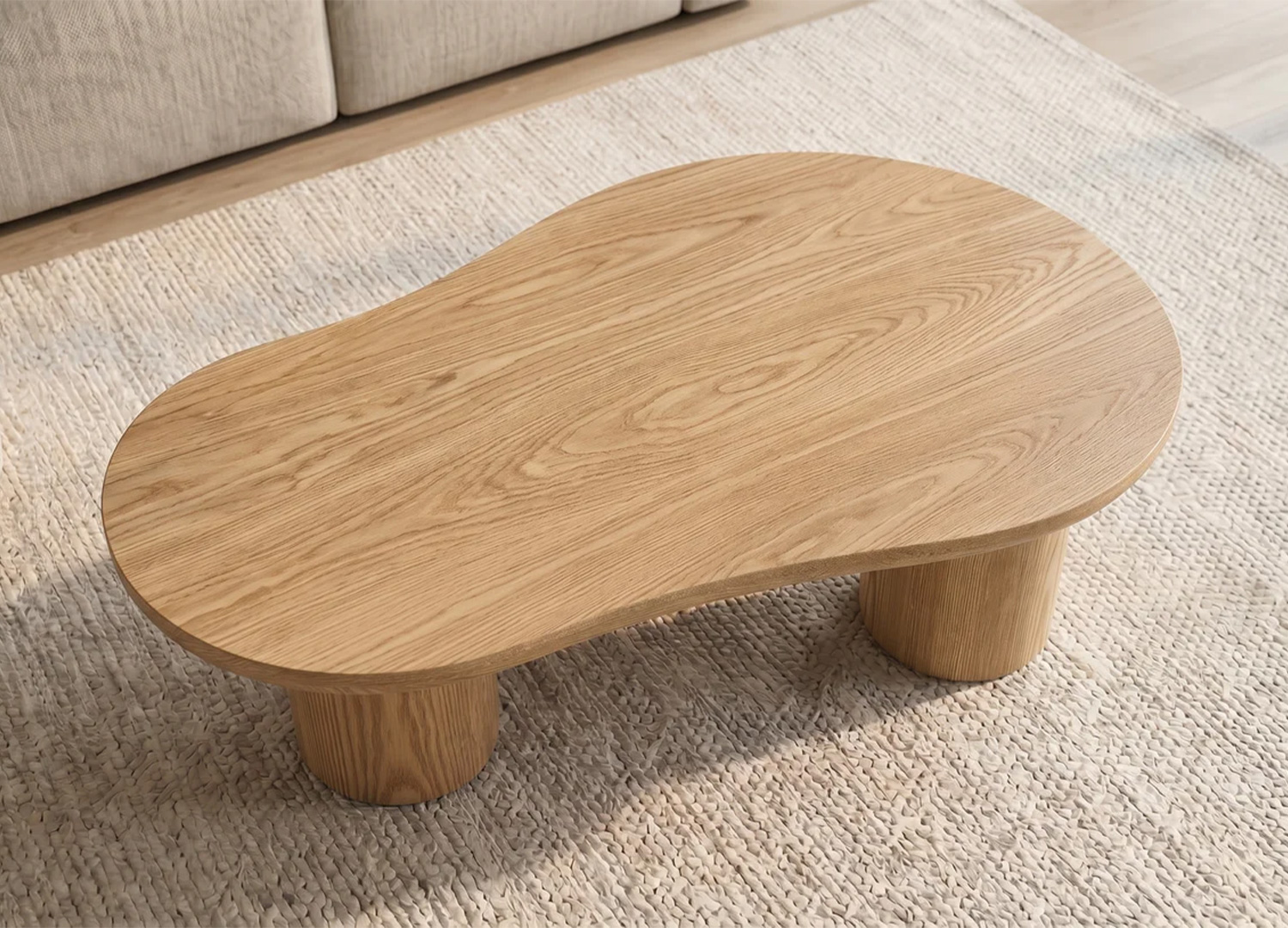 Vue haute de la table basse organique NÉRAYA 130 cm en placage chêne