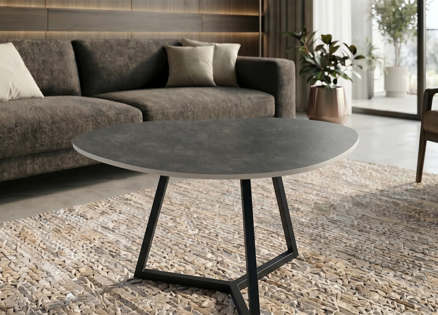 Détail de la finition en céramique anthracite de la table basse ORBIS 70 cm