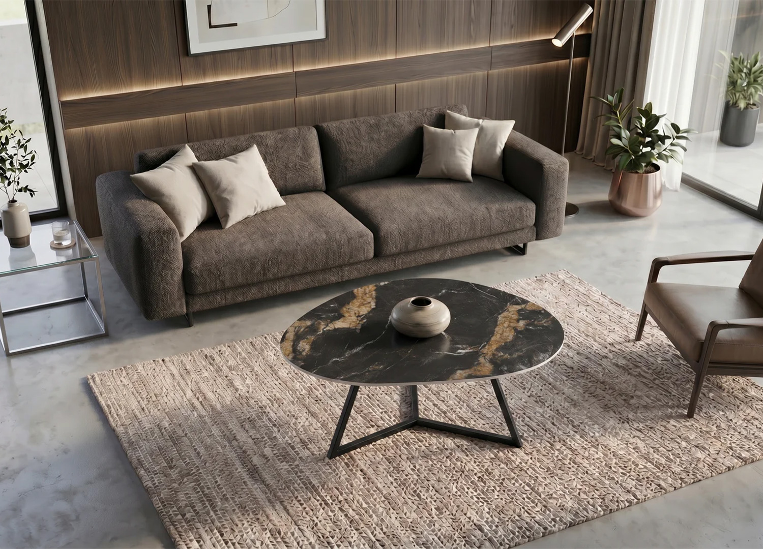 Table basse ORBIS 90 cm en céramique noir doré dans un salon élégant avec canapé gris